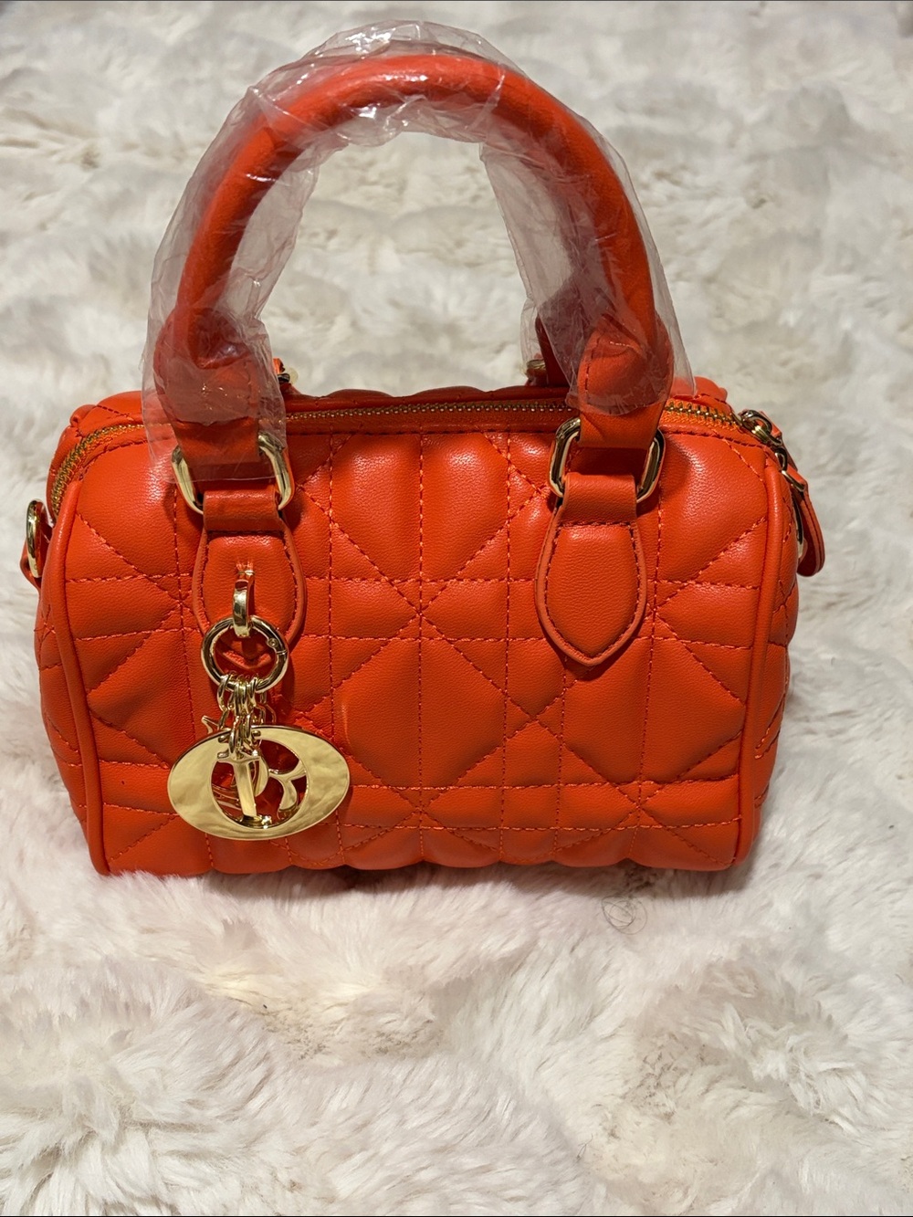 Quilted Orange Top-Handle Satchel with Gold Charm